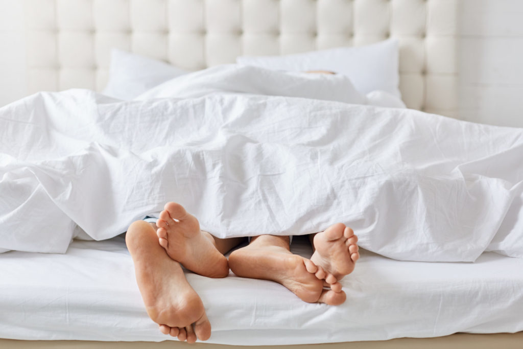 Horizontal shot of feet of couple